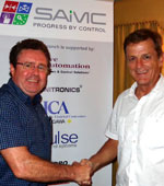 Keith Mitchell (left) being thanked by Durban branch chairman, Howard Lister, after the presentation.